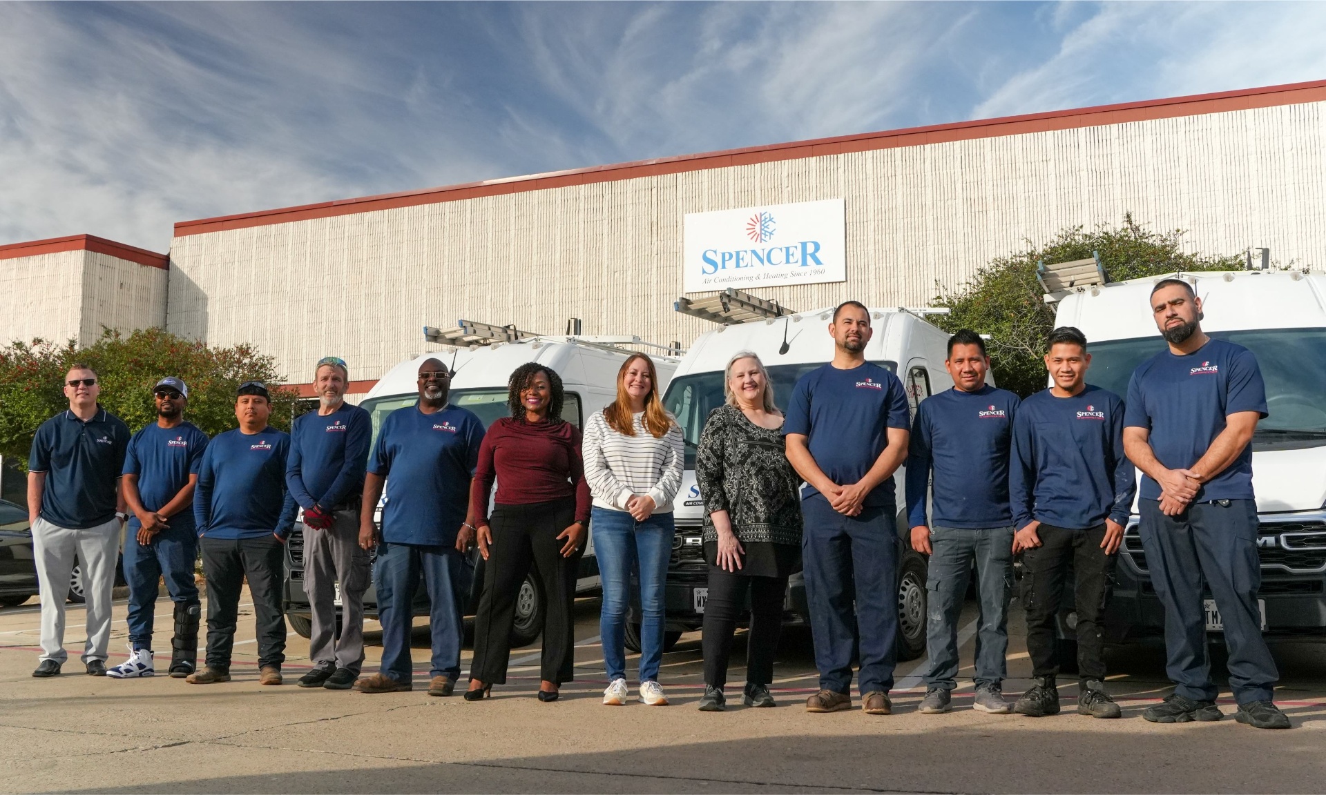 The full Spencer Air Conditioning & Heating team in front of the Irving, TX headquarters