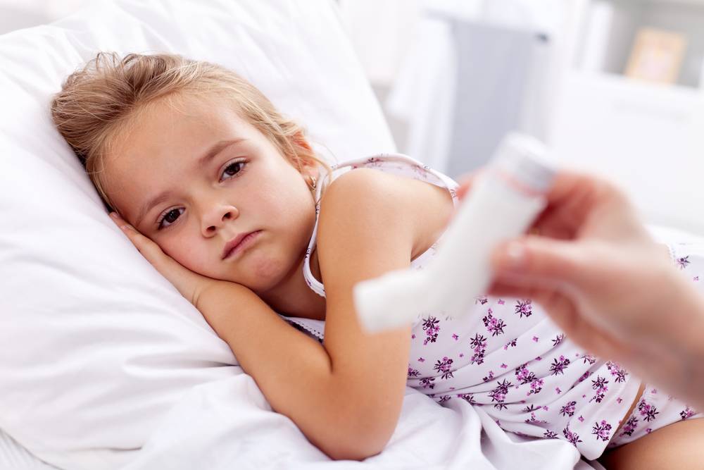 allergy-induced asthma to a girl lying down on the bed